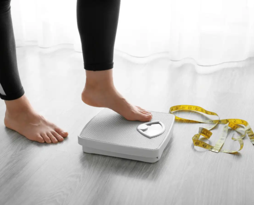 Woman with Scales at Home